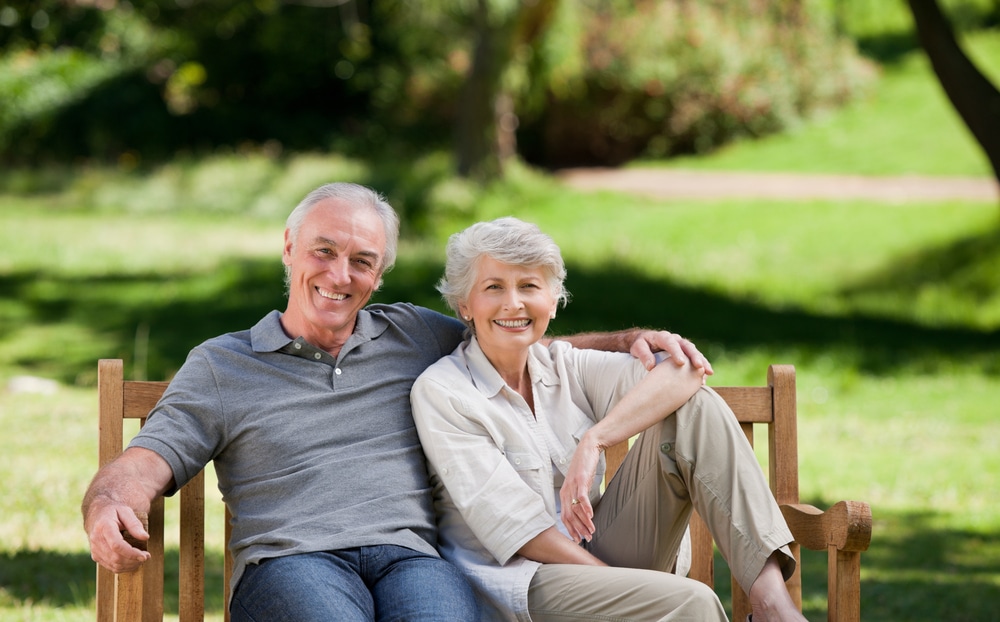 Senior,Couple,Sitting,On,A,Bench
