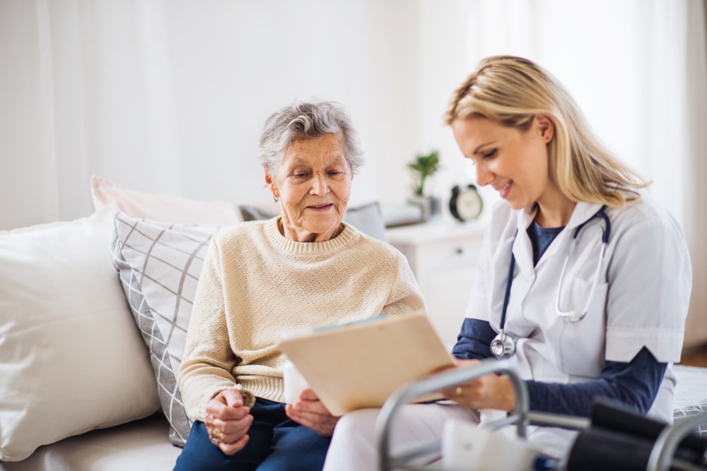 A,Health,Visitor,And,A,Senior,Woman,Sitting,On,A