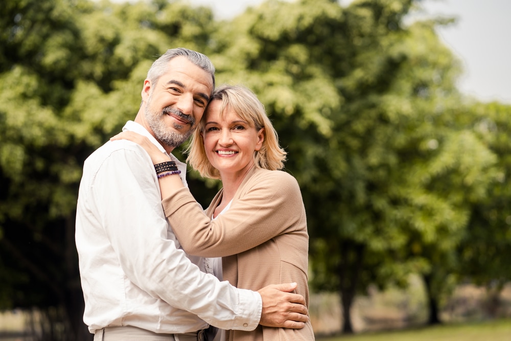 Senior,Elder,Caucasian,Couple,Sitting,On,Ground,Together,In,Park